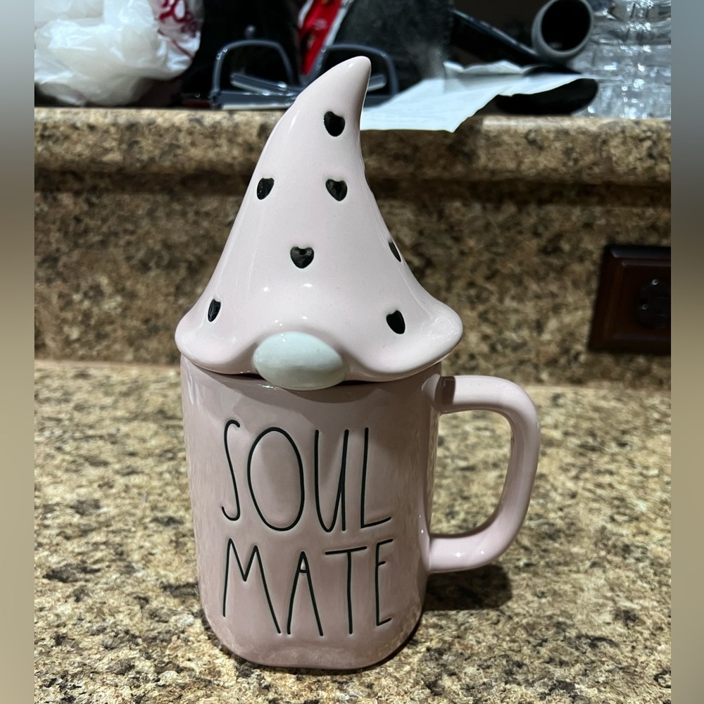 Brand new and never used Rae Dunn Sole Mates mug with topper.